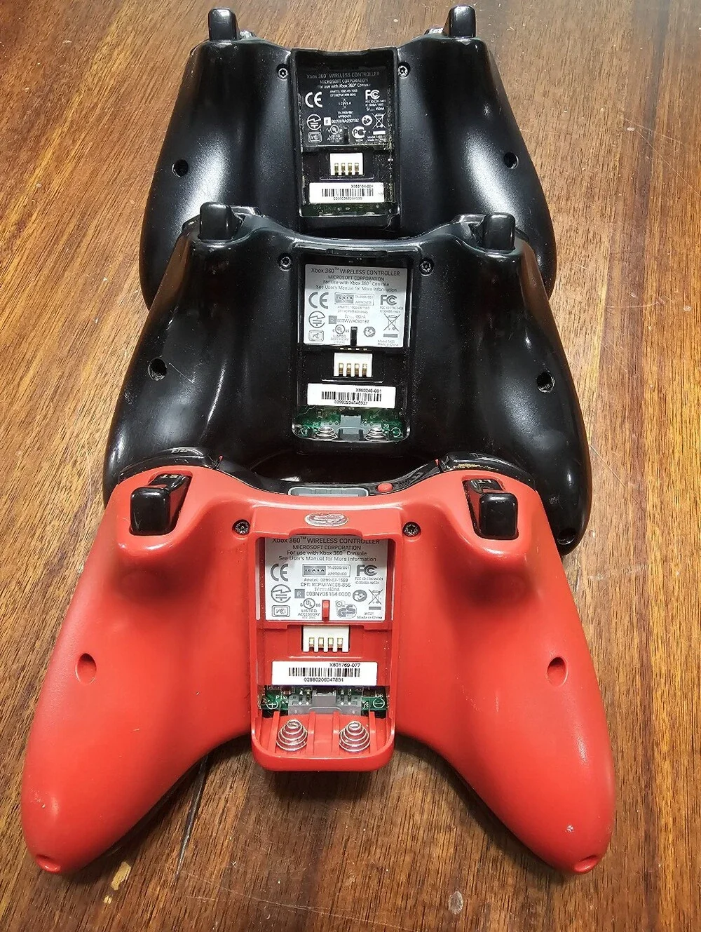 Lot Of Three Xbox 360 Wireless Controllers - Black and Red Variants